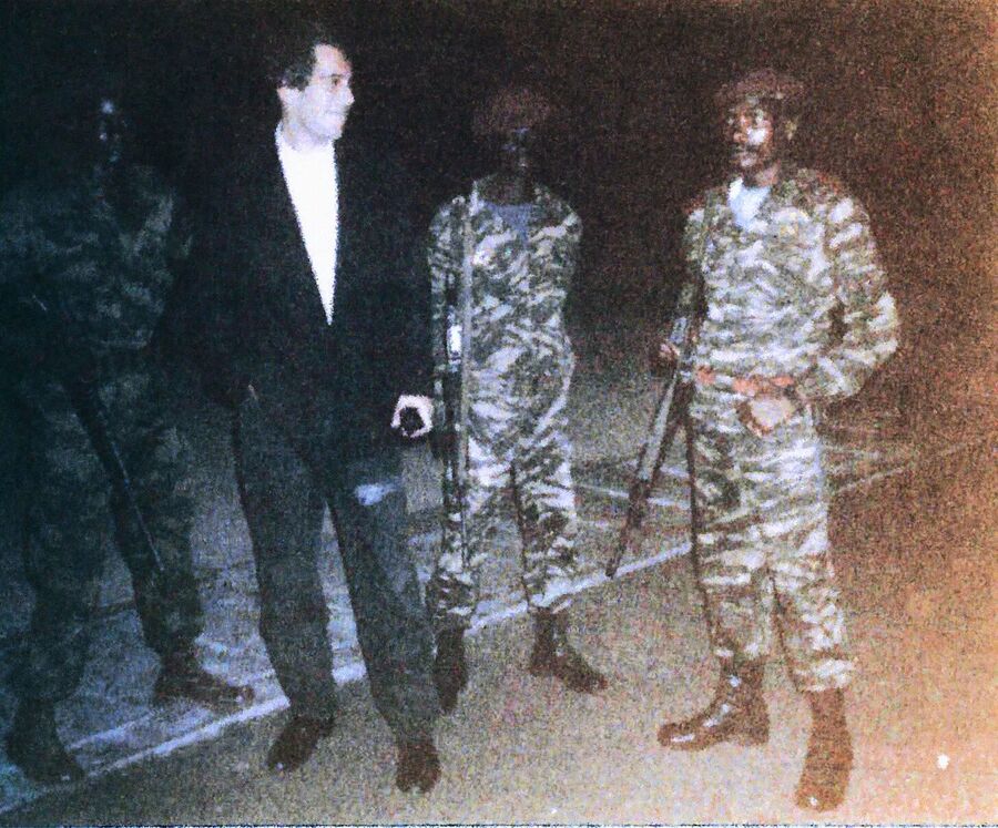 Jeffrey Epstein with unidentified soldiers in Africa