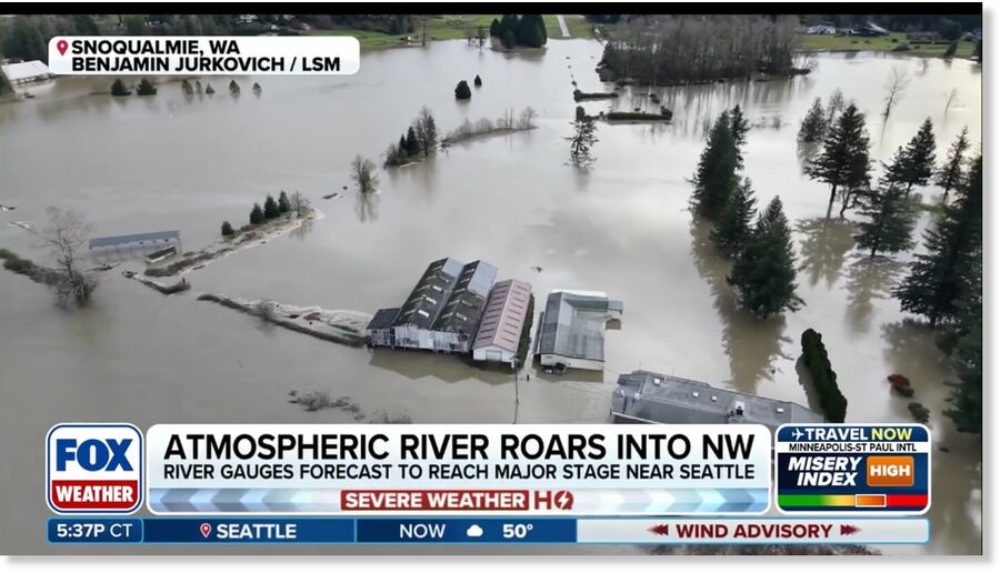 Clic para aumentar Drone footage captured major river flooding near Fall City, Washington stemming from the Snoqualmie River, located just east of Seattle, showcasing residences and farms inundated by major river flooding.