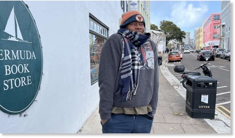 All bundled up: after the mercury dropped to 45.1F this weekend, Scott Holder of the Bermuda Book Store wrapped up to survey conditions in Hamilton yesterday