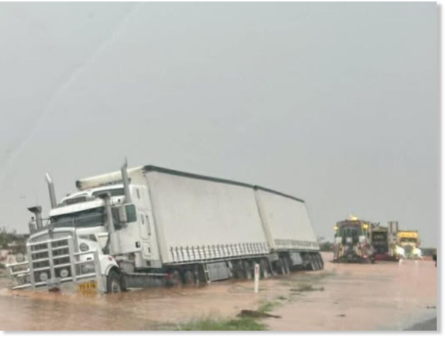 A truck became stuck in the floodwaters on the Barrier Highway.